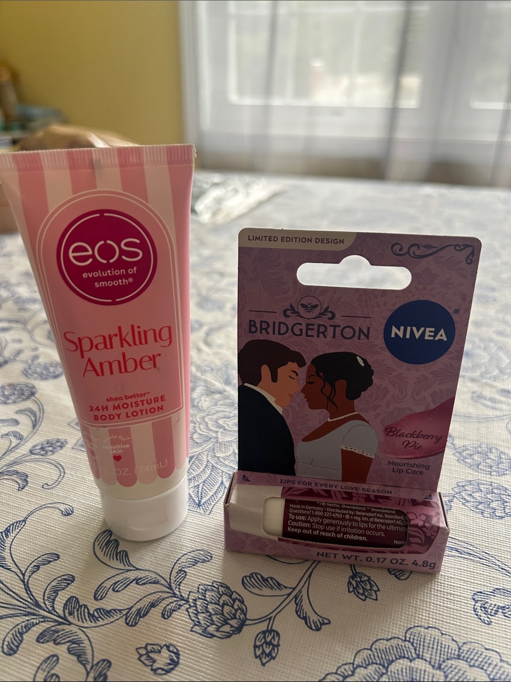 eos Sparkling Amber Body Lotion & Pink Bridgerton Nivea Lip Balm - Pink
